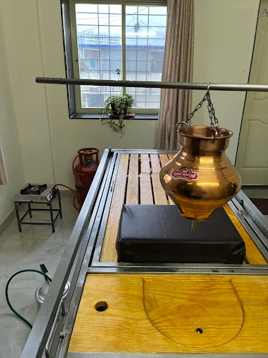 Authentic Shirodhara equipment in the Panchkarma therapy room at Aarogya Anvee Clinic