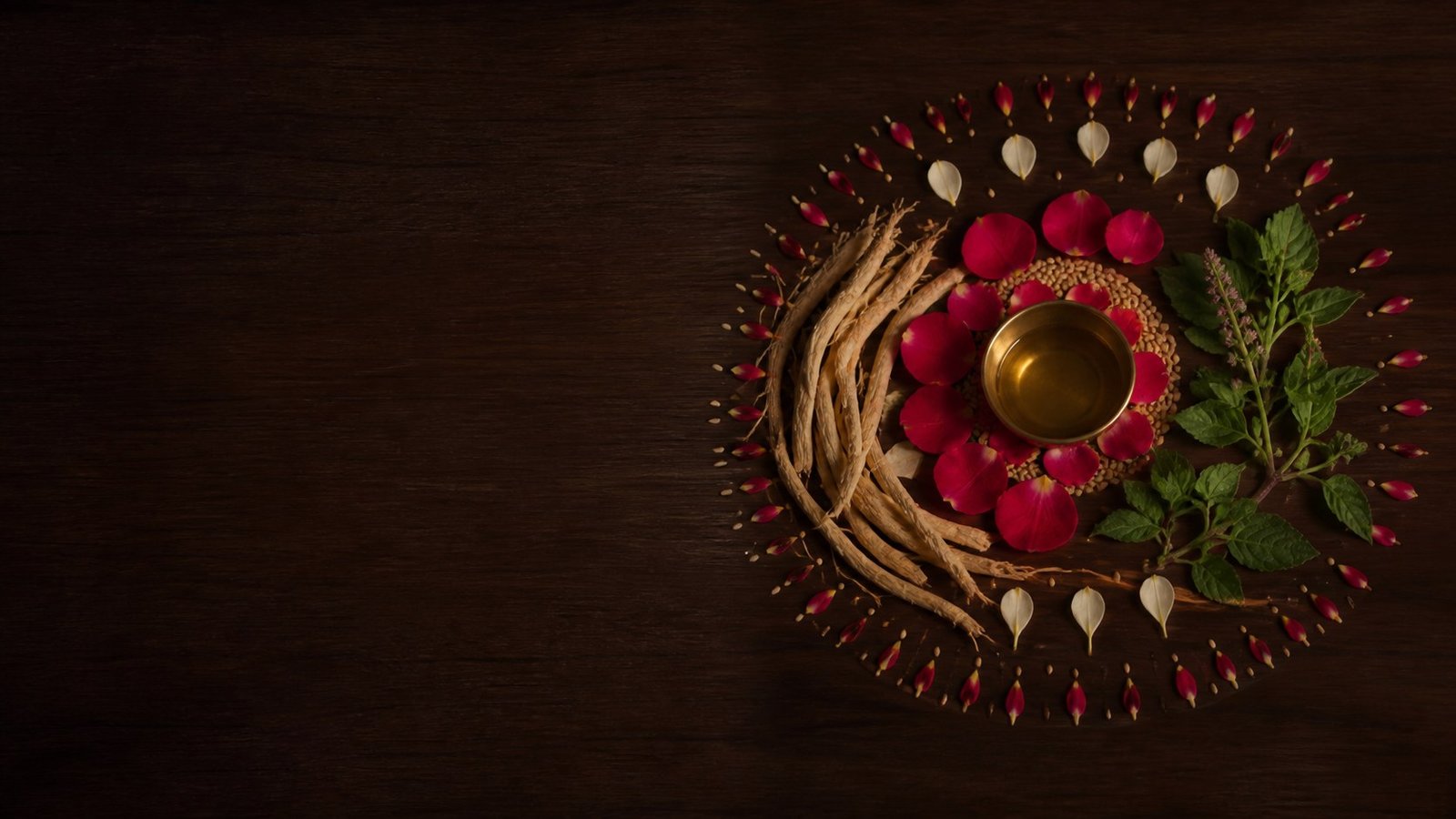 Ayurvedic herbs and rose petals arranged to represent menstrual cycle wellness